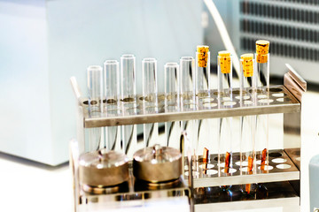 Glass vials in a metal container.