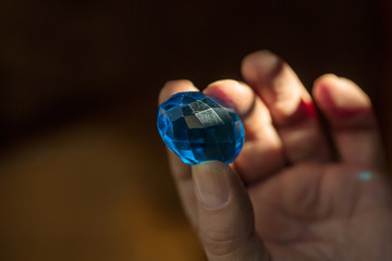 Blue gem in the hand