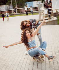 Young girls with skateboard.