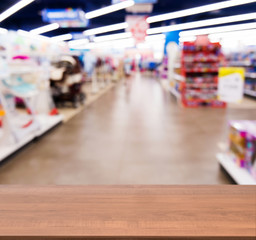Wooden empty table in front of of kids toy store