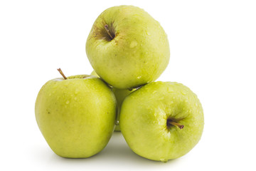 Bunch of raw organic golden delicious apples isolated on white background