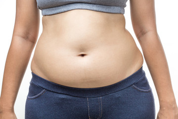 Naklejka premium overweight woman with hand holding fat belly