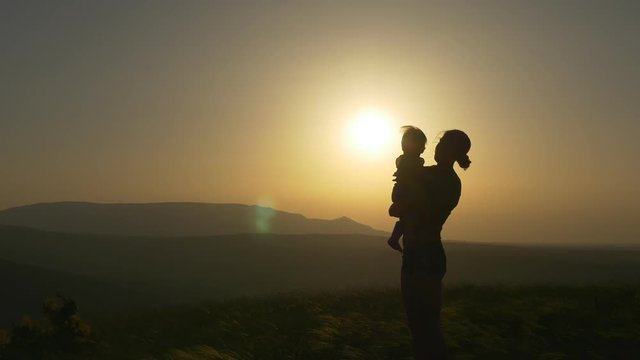 Silhouette of mother with baby