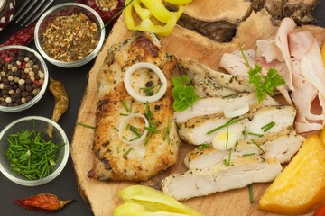 Grilled chicken steak with spices and vegetable. Dietary food for athletes. Healthy diet meals. Fried chicken. Steak ready for the grill.
