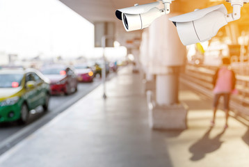 CCTV or surveillance camera recording of traffic in the parking lot for taxis carry passengers inside the departure hall of  the airport.