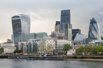 Futuristic skyscrapers in city of london  on a cloudy day along river Thames