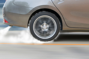 The show car was drifting on the racetrack and cause smoke from the exhaust and tire friction with...