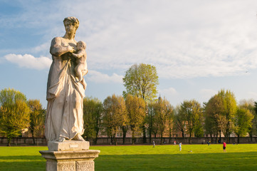 Ornamental white stone statues along the main avenue of Querini park in Vicenza