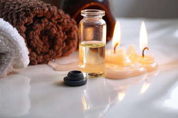 Spa set with essential oils, towel and aromatic candles 