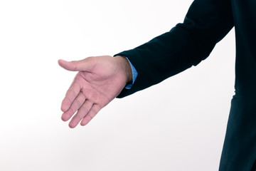 Businessman extending hand to shake.