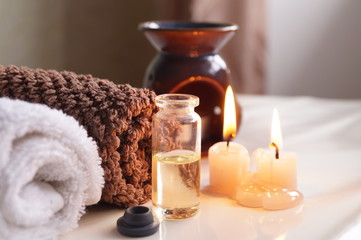 Spa set with essential oils, towel and aromatic candles 