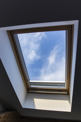 roof hung window with a view of the sky from the room