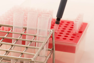 Pipette adding tips and test tubes in laboratory.Selective focus.Medical equipment.