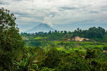 Mount Sinabung Volcano in North Sumatra - obrazy, fototapety, plakaty