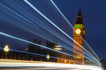 Fototapeta na wymiar Light trails front of Big Ben and houses of parliament at night