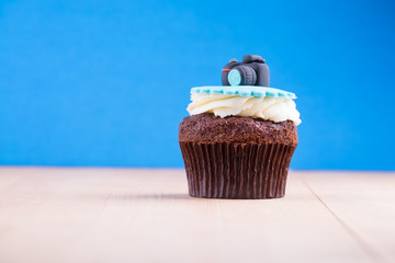 Delicious cupcake on table