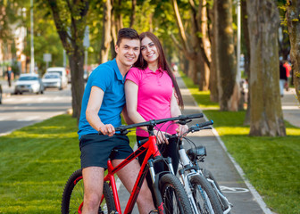Cycling young couple.