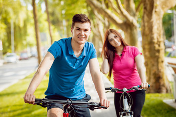 Cycling young couple.