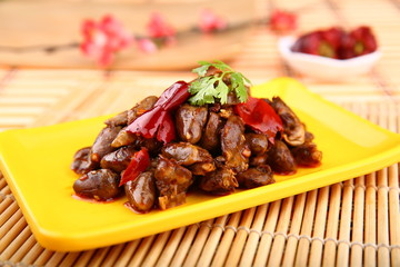 Fried chicken's hearts on yellow plate