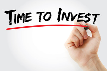 Hand writing Time to Invest with marker, concept background