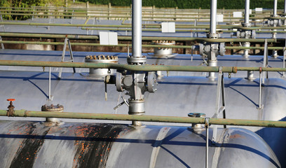 pipes and safety valve above the gigantic pressure vessel
