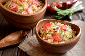 Chinese cabbage salad with carrot, red onion and apples