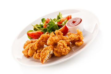 Fried chicken nuggets and vegetables