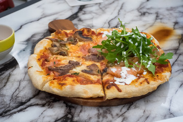 pizza served on table