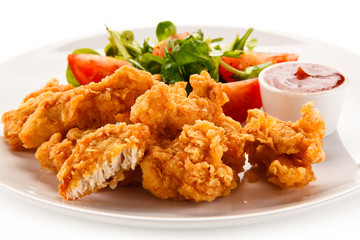 Fried chicken nuggets and vegetables