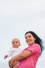 Beautiful Mother And Baby together plaingoutdoors.