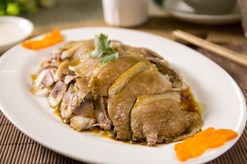 Sliced fried pork of Chinese style on white plate