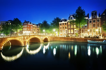 Fototapeta na wymiar Canal in Amsterdam at night, Netherlands