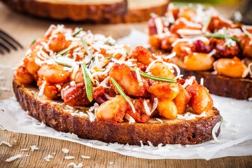 baked beans with rosemary and parmesan on toast