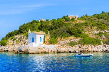 Small white church on coast of Ithaka island near Vathi town, Greece