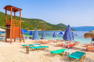 Lifeguard tower and sunbeds on Antisamos beach on Kefalonia island, Greece