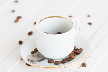 Coffee grinde and coffee beans on wooden desk
