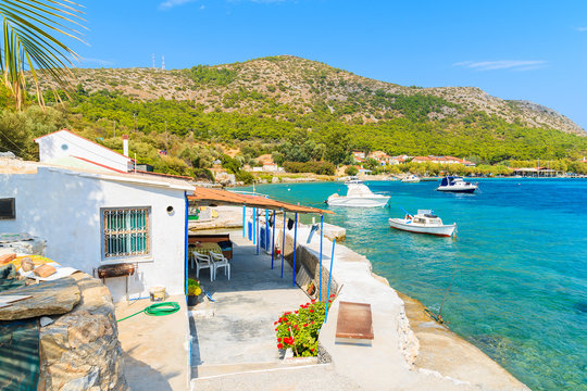 Fishing village buildings on beautiful coast of Samos island at Posidonio bay, Greece
