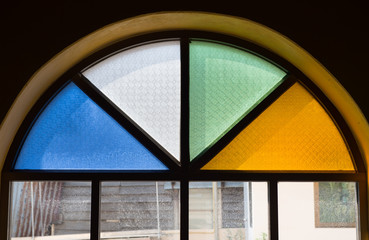 Old window with colorful glass
