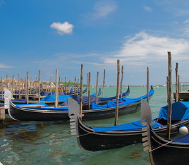Fototapeta na wymiar Blue Gondolas in Venice, Italy