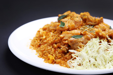 Fried riced with herbs on white dish