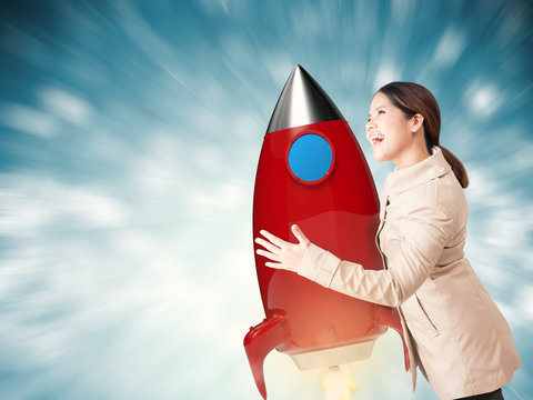 start up concept with asian woman hanging with space shuttle