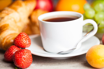 breakfast with croissants,coffee and juice on natural background