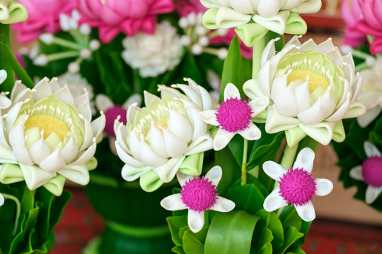 Artificial flowers / Close up artificial flowers, beautiful decoration flowers lay on the table.