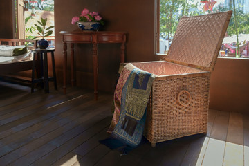 Box fabric / Box fabric crafts made of wicker in ancient thai style house.