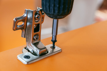 assembly of furniture made of particleboard