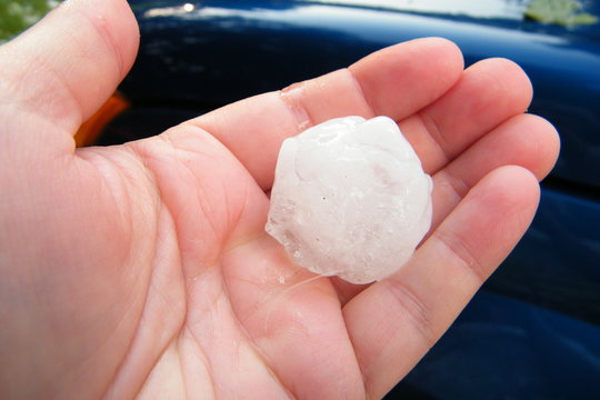 Single Large Hail Stone in a Hand