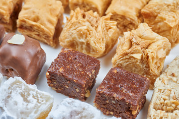 Oriental sweets on a white plate. Turkish or greek delight