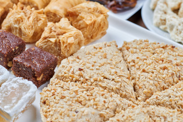 Oriental sweets on a white plate. Turkish or greek delight