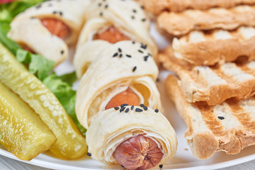 Sausages baked in a puff pastry