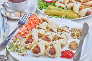 Sausages baked in a puff pastry